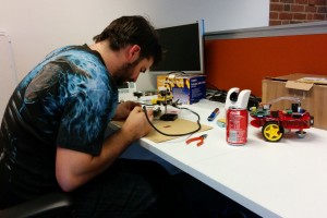 Jason repairing fire damaged robots