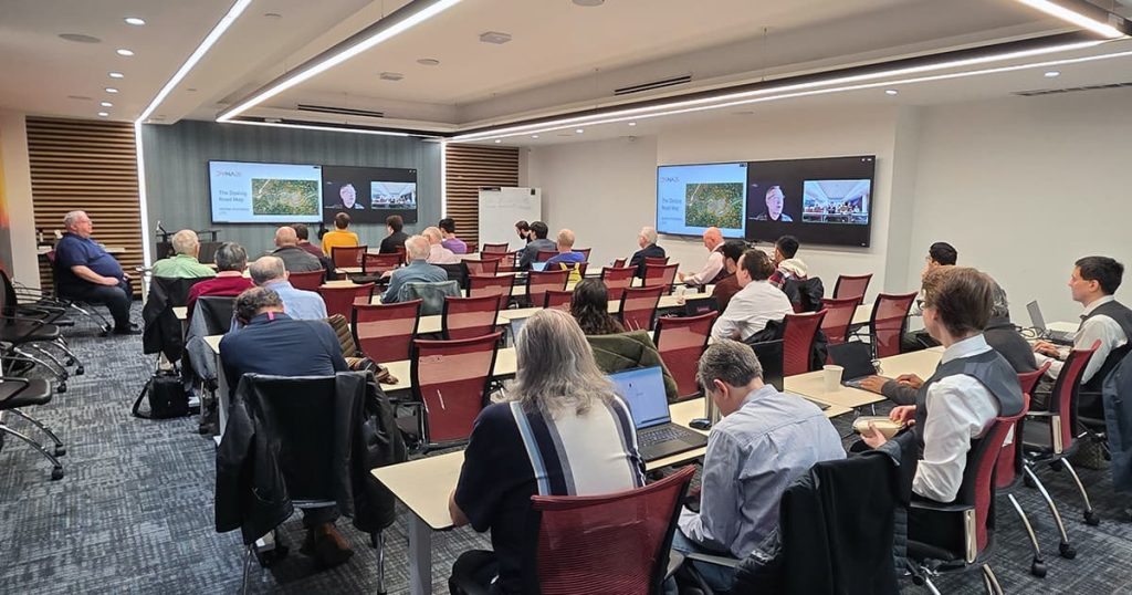 Attendees watch Morten's presentation